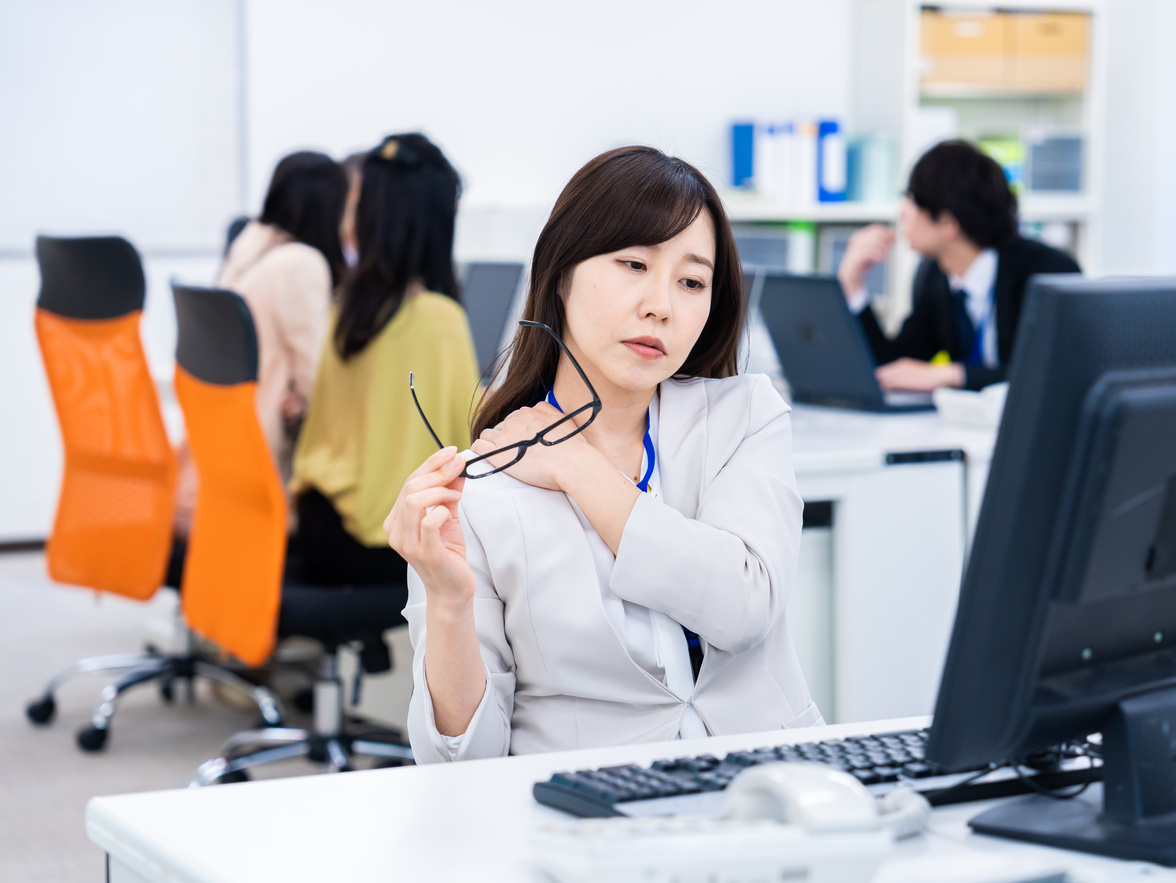 Businessperson Suffering from Stiff Shoulders