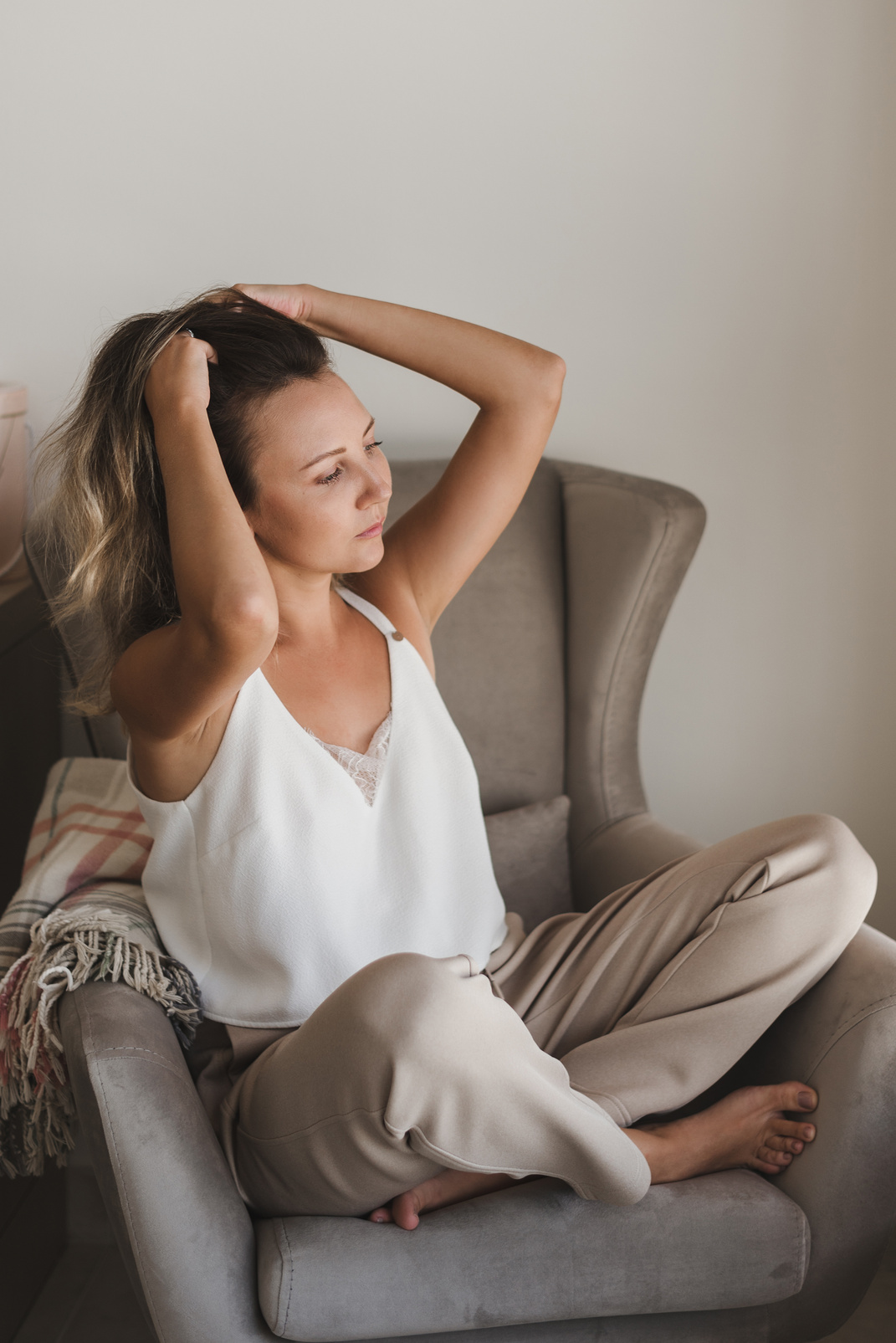 Woman Doing A Scalp Massage Sitting On The Chair
